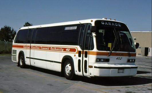 A color photo of a white, red, and orange CPTA bus.