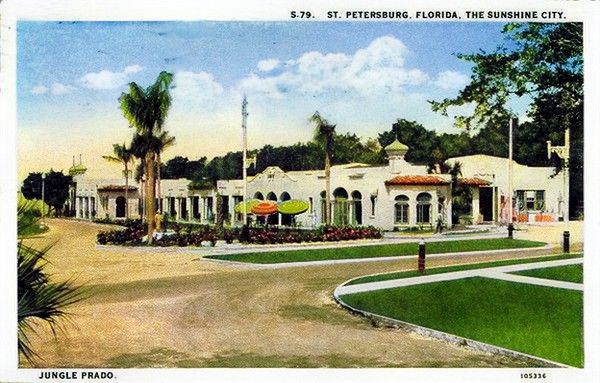 An old colorized postcard of the Jungle Prado (later called "Jungle Prada"). It's a large unique white building with arched windows.