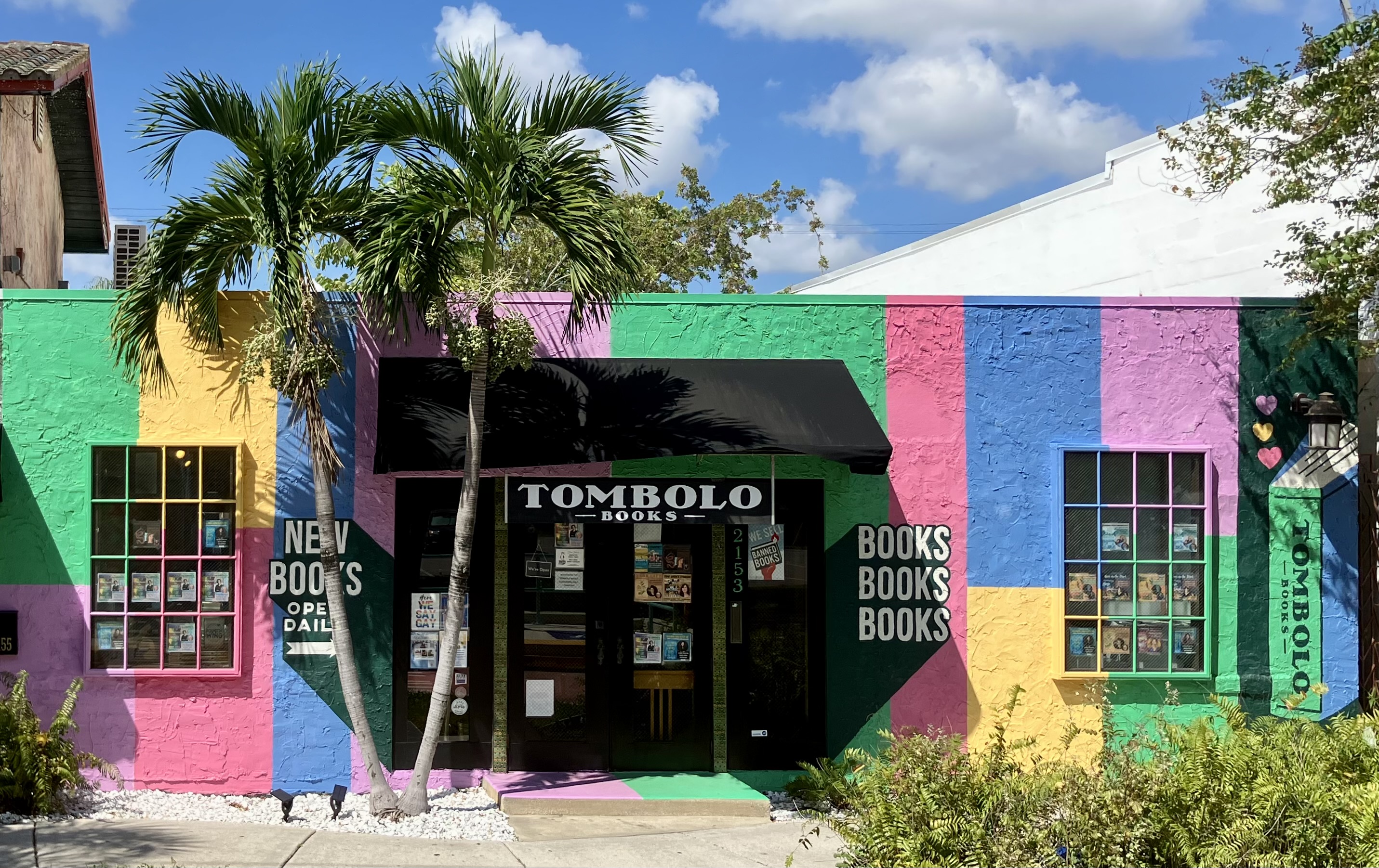 A photo of the front of Tombolo Books. The front is painted with bright rainbow colored blocks.