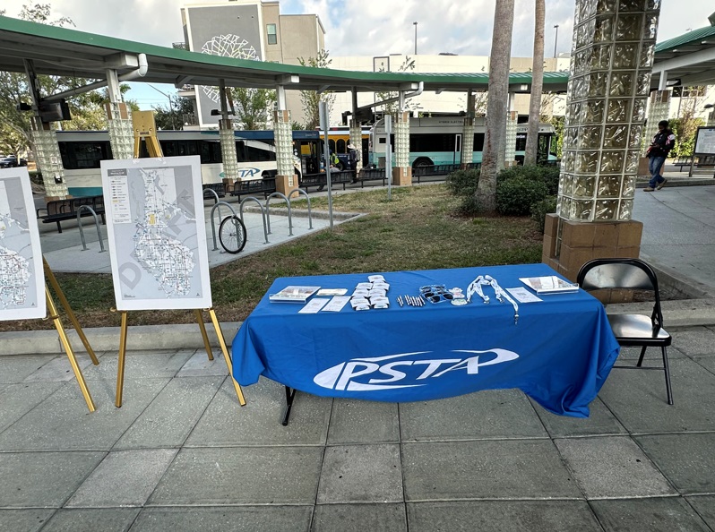 A photo of a PSTA and tables for an outreach event outside Grand Central Station.