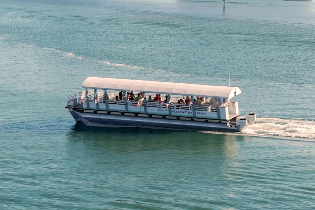 Photo of the Clearwater Ferry moving through water.