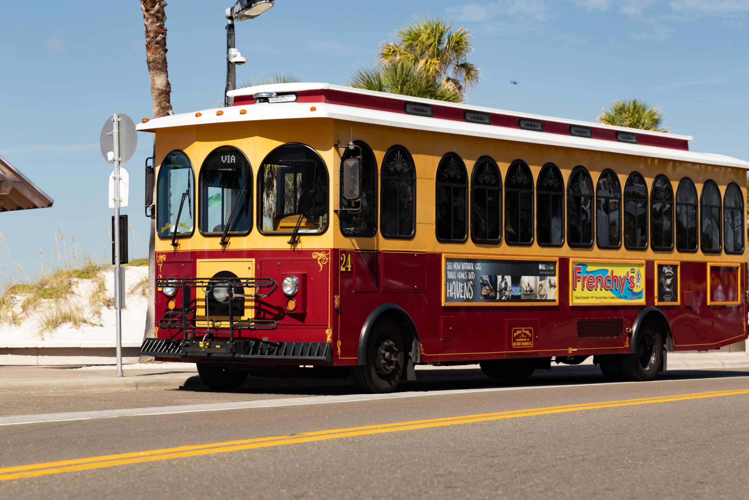 A photo of a Jolley Trolley bus at the beach.