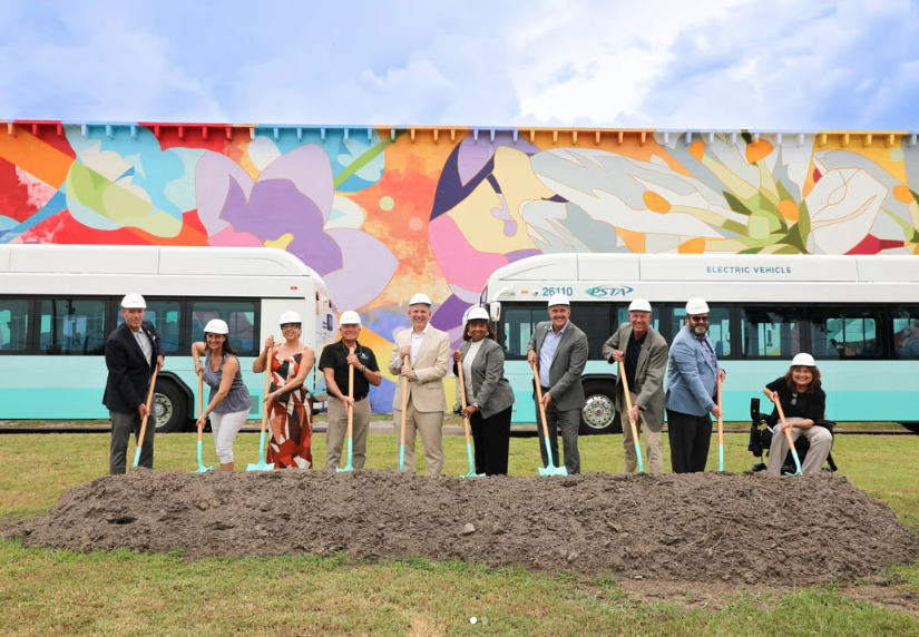 A photo of PSTA staff, Board members and local leaders wearing hard hats and shoveling dirt at the groundbreaking for Clearwater Station. Gloria is pictured on the far right.